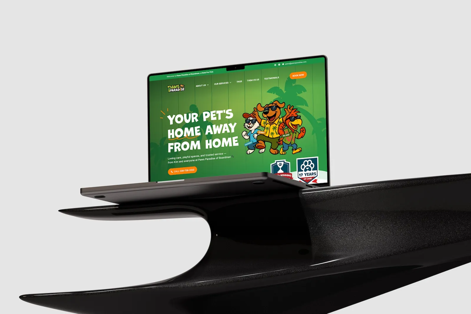 The Paws Paradise website on a laptop